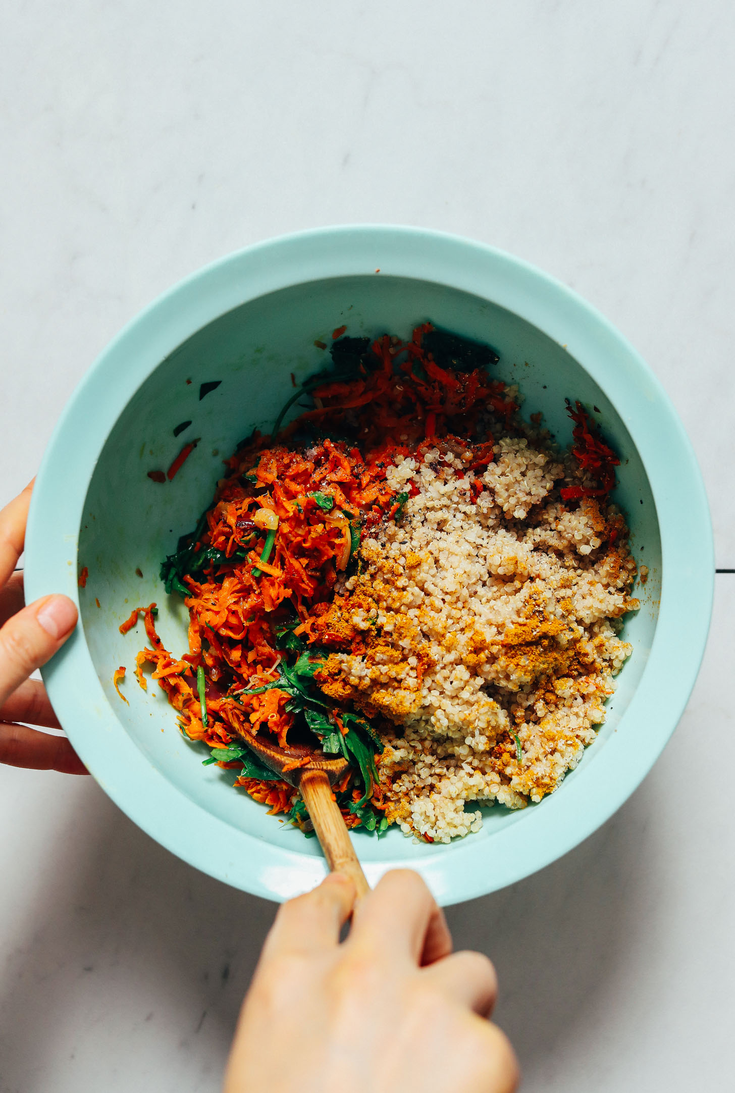 Stirring the veggies and quinoa for our Sweet Potato Quinoa Fritters recipe