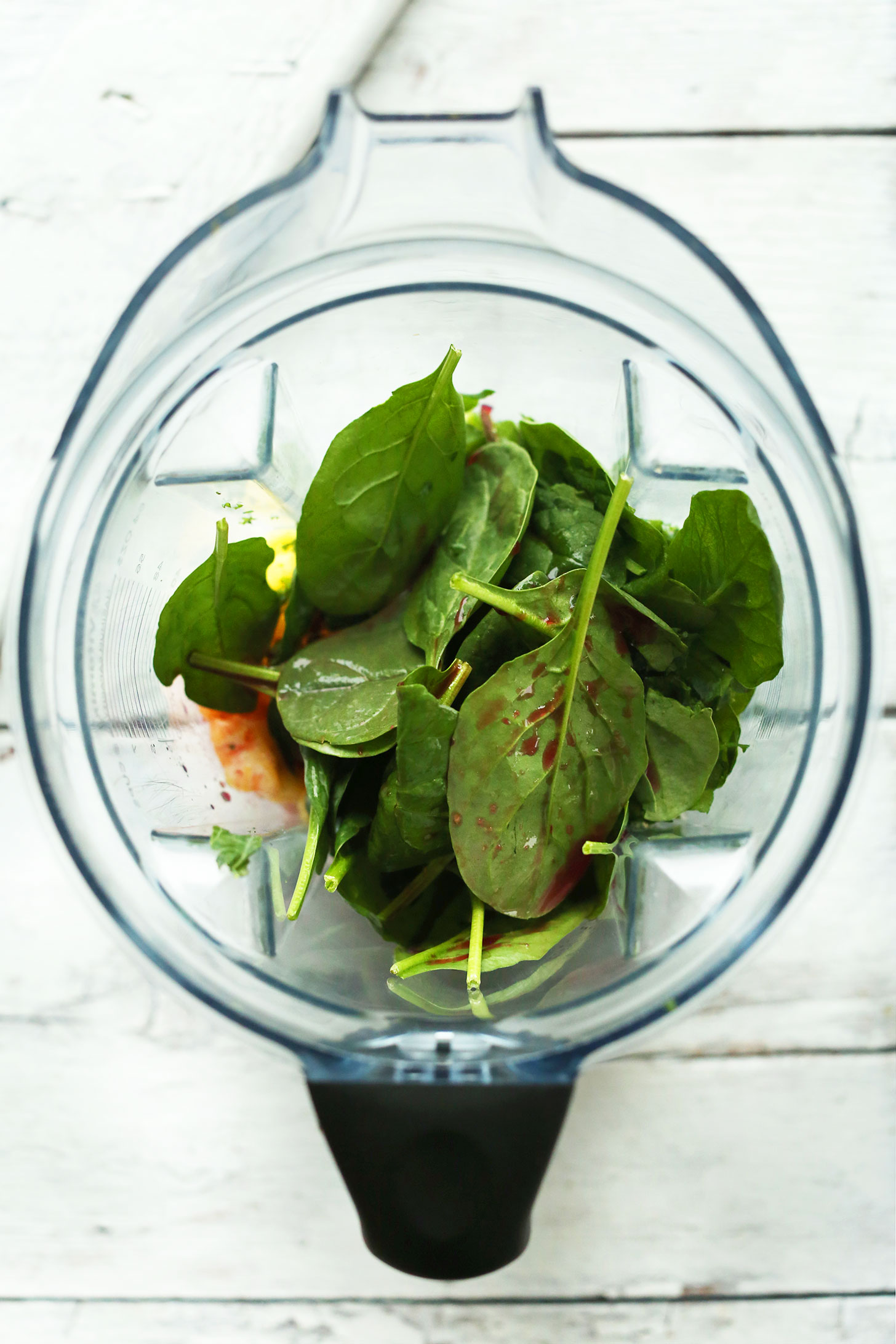 Blender filled with ingredients for making our healthy vegan Blood Orange Green Smoothie recipe