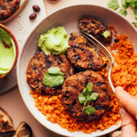 Spicy mushroom black bean fritters over sweet potato rice