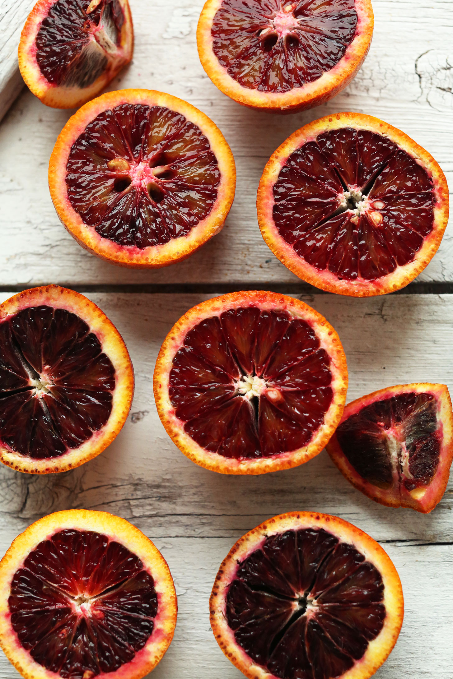 Halved blood oranges for making our amazing vegan Blood Orange Green Smoothie