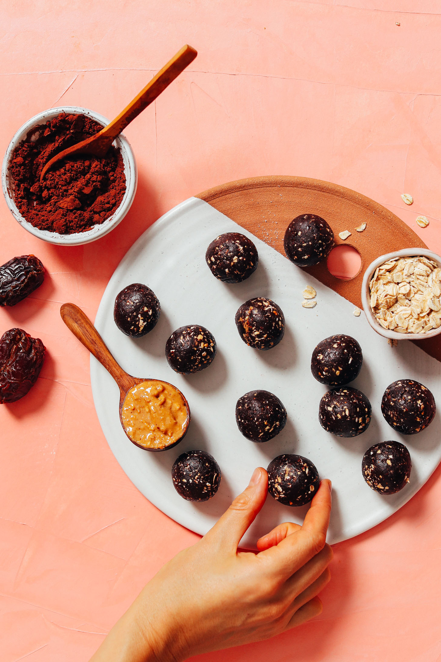 Setting a No Bake Cookie Energy Bite onto a tray