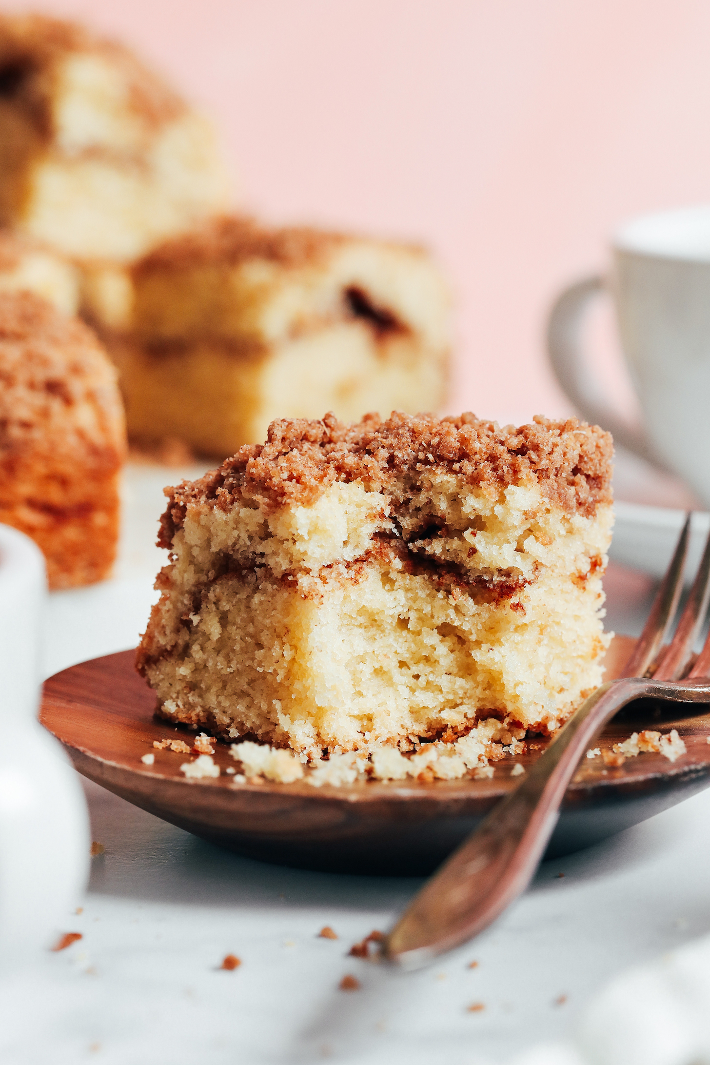 Plate with a slice of gluten-free dairy-free cinnamon swirl coffee cake