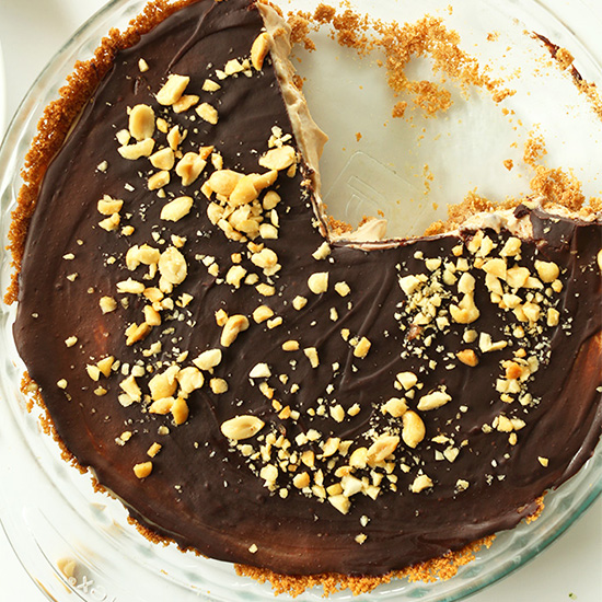 Vegan Peanut Butter Cup Pie in a pie pan with a couple slices removed