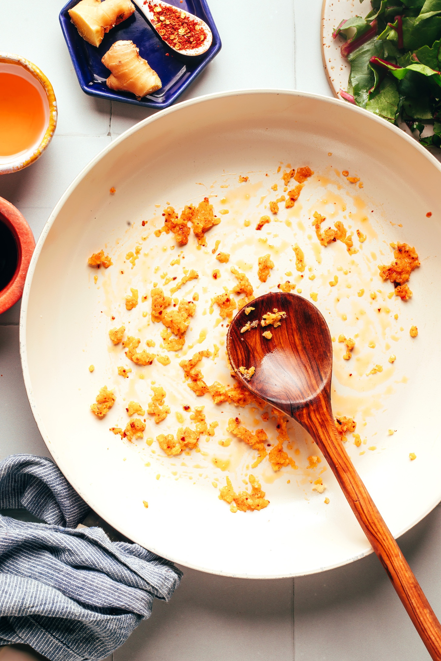 Sautéed garlic, ginger, and red pepper flakes in a skillet