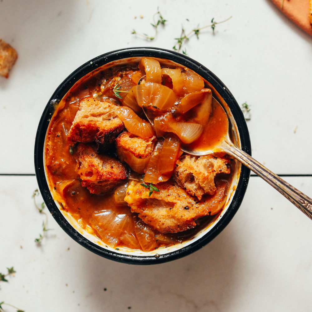 Bowl of vegan french onion soup with homemade croutons