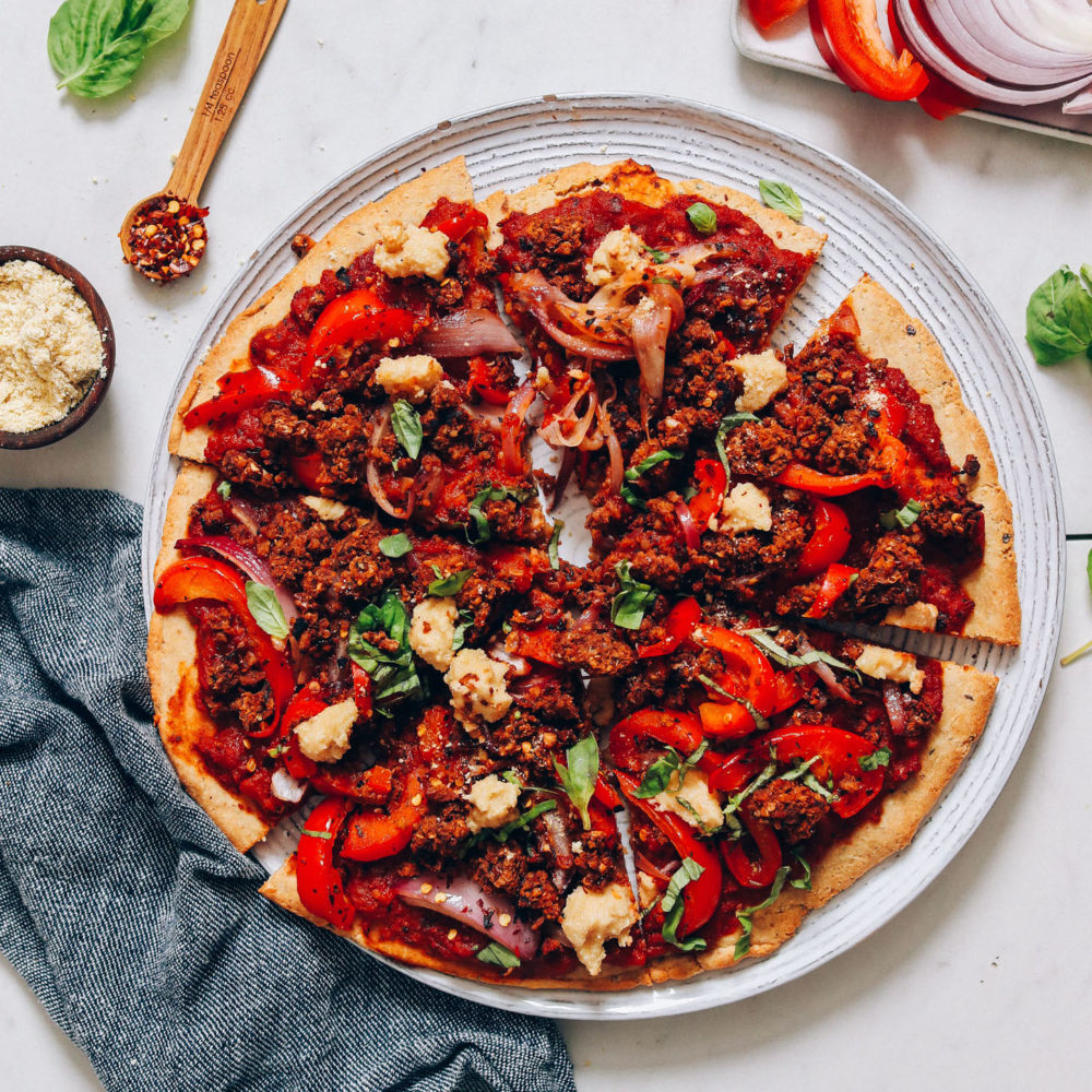 Plate of our vegan pizza made with veggies and homemade sausage