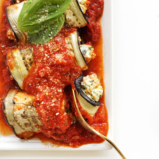 Using a fork to slice off a bite of an Eggplant Lasagna Roll-Up